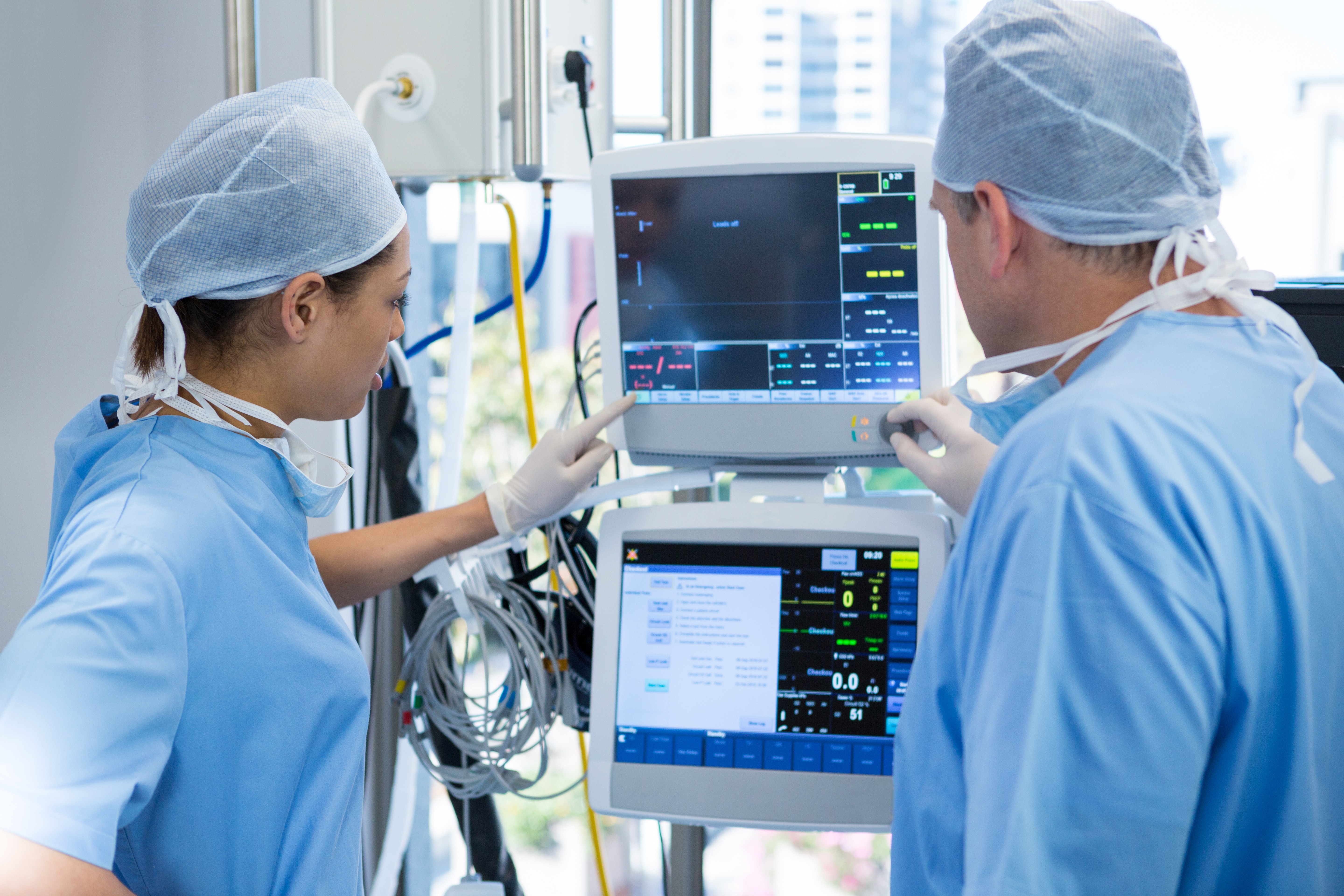 Doctors at work monitoring vital signs on a monitor